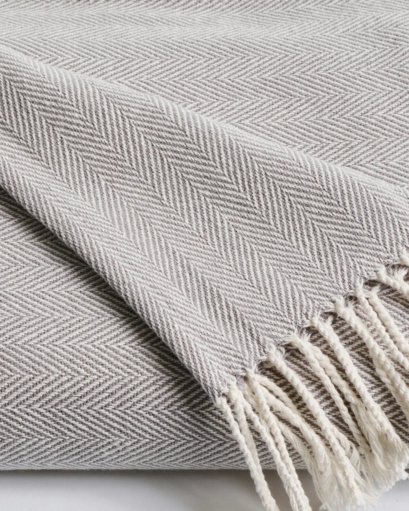 Petite Plume Herringbone Throw in Light Heather Grey